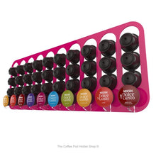 Pink, wall mounted, self adhesive Dolce Gusto coffee pod capsule holder. Holds 40 pods in 10 rows.