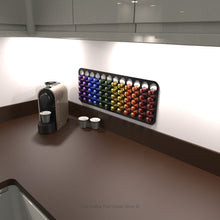 Black short Nespresso original coffee pod capsule holder mounted on wall under kitchen cupboard.