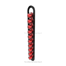 Black, wall mounted, self adhesive Nespresso original line coffee pod capsule holder. Holds 10 pods in 1 row.