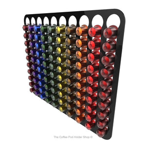Black, wall mounted, self adhesive Nespresso original line coffee pod capsule holder. Holds 100 pods in 10 rows.