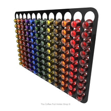 Black, wall mounted, self adhesive Nespresso original line coffee pod capsule holder. Holds 120 pods in 12 rows.