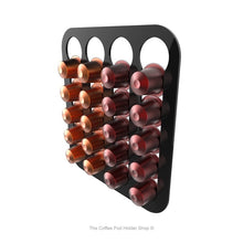 Black, wall mounted, self adhesive Nespresso original line coffee pod capsule holder. Holds 20 pods in 4 rows.