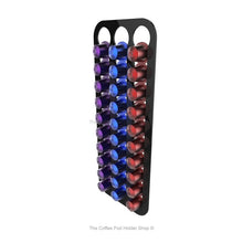Black, wall mounted, self adhesive Nespresso original line coffee pod capsule holder. Holds 30 pods in 3 rows.