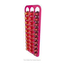 Pink, wall mounted, self adhesive Nespresso original line coffee pod capsule holder. Holds 30 pods in 3 rows.