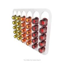 White, wall mounted, self adhesive Nespresso original line coffee pod capsule holder. Holds 30 pods in 6 rows.