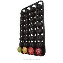 Black, wall mounted, self adhesive Dolce Gusto coffee pod capsule holder. Holds 32 pods in 4 rows.