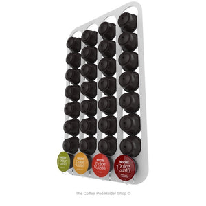 White, wall mounted, self adhesive Dolce Gusto coffee pod capsule holder. Holds 32 pods in 4 rows.